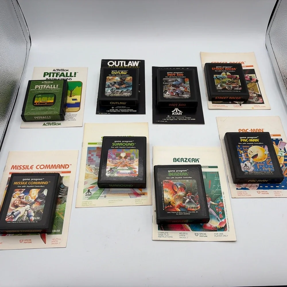 Lot of 8 Atari 2600 Games Pac-Man Pitfall Missile Command Berzerk with Manuals